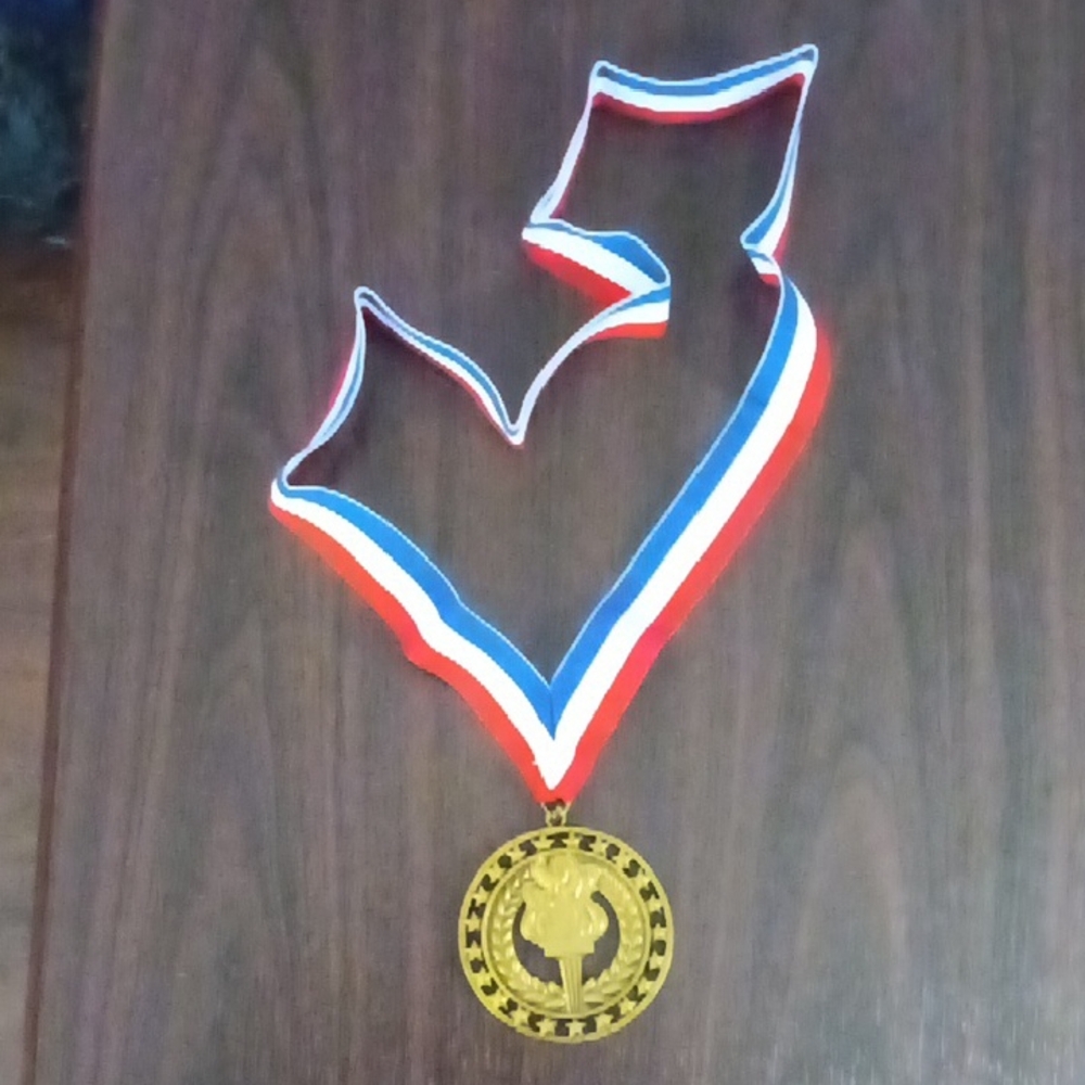 Gold Metal Medal with Red, White, and Blue Ribbon